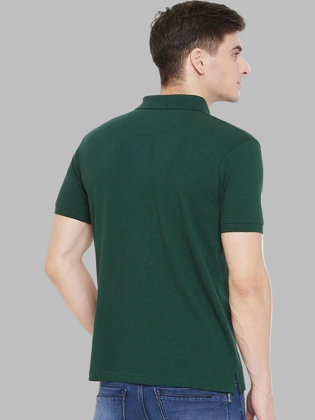 Man wearing a green polo shirt against a white background