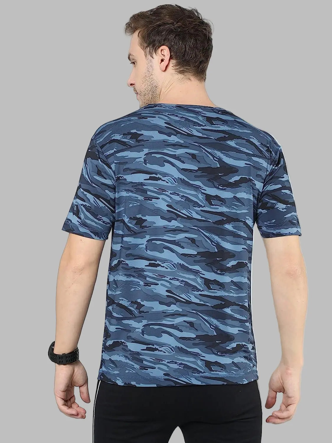 Man wearing a blue camouflage t-shirt on a white background