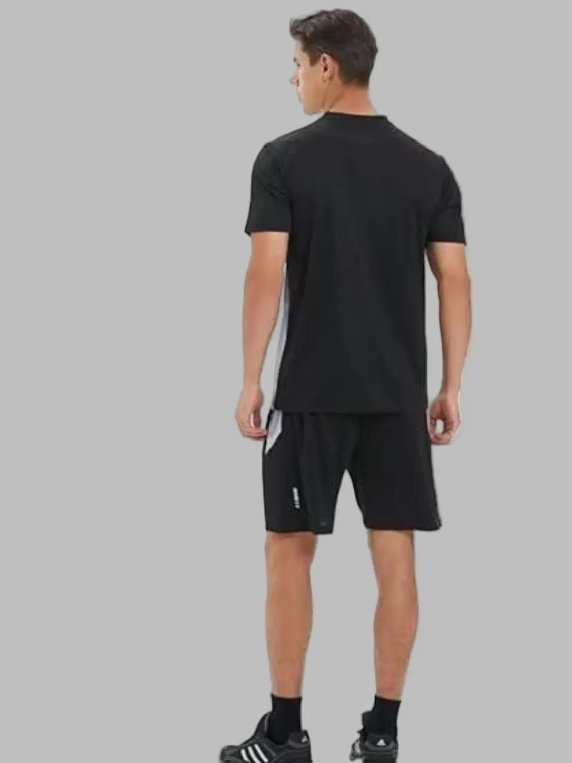 Person wearing a black t-shirt and shorts