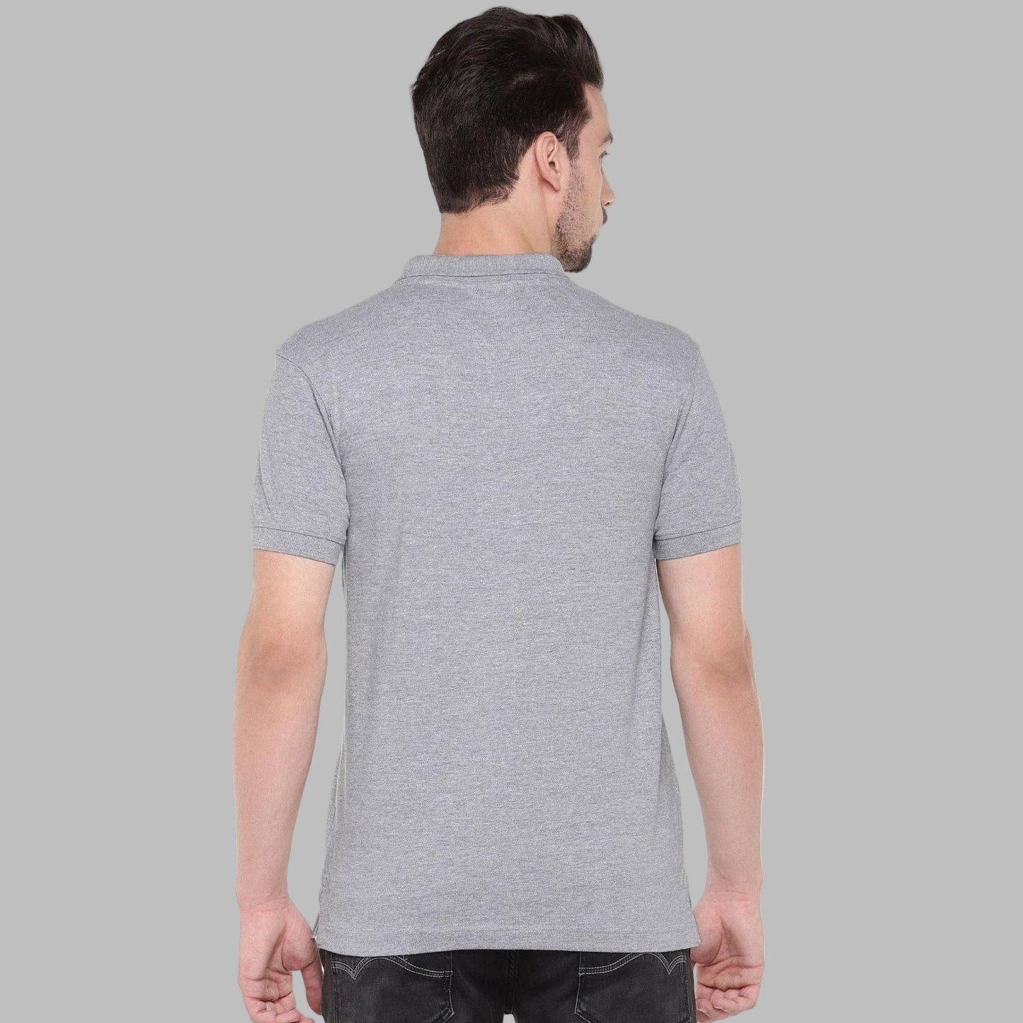 Man wearing a gray polo shirt on a white background