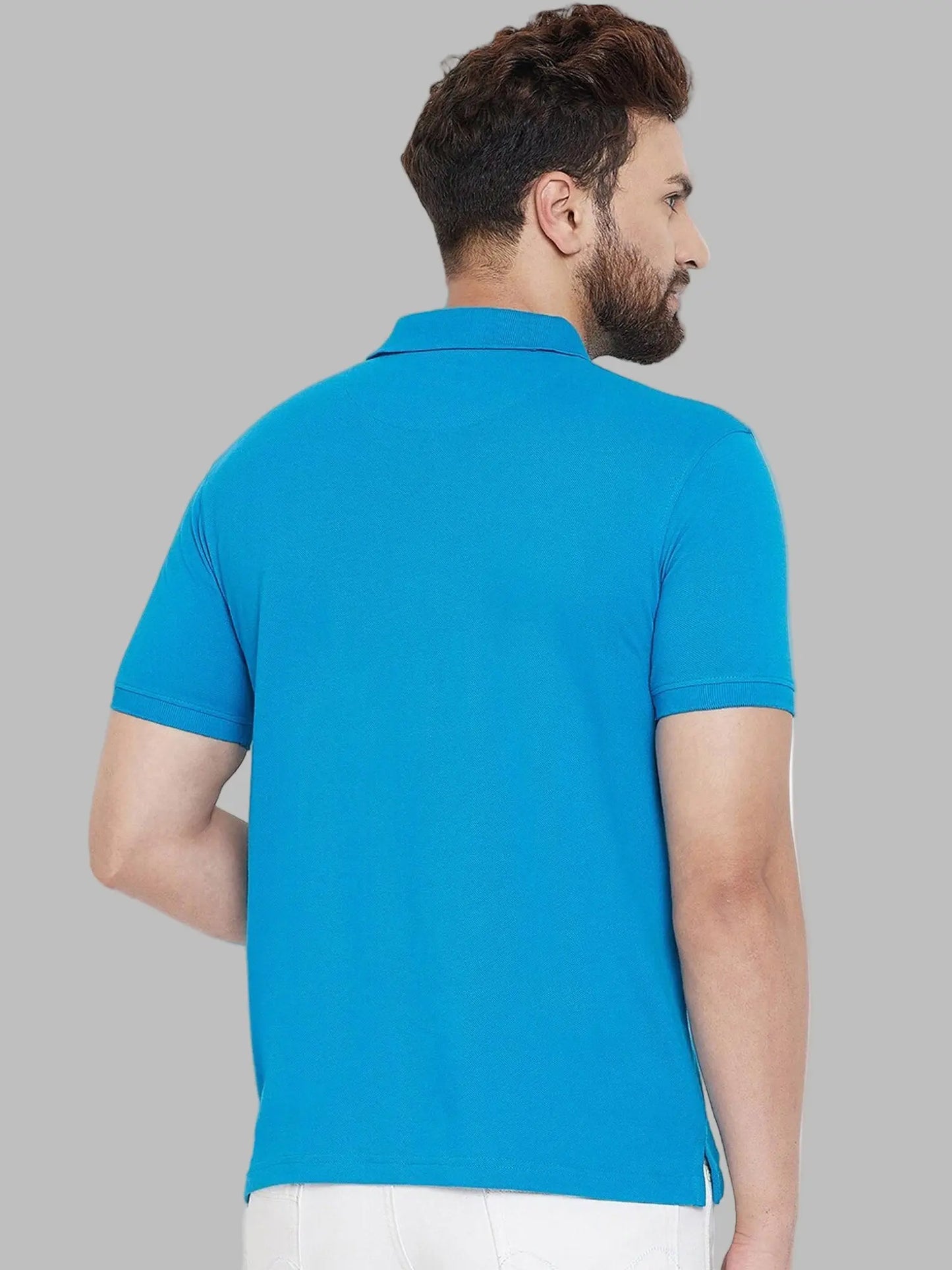 Man wearing a blue polo shirt on a white background