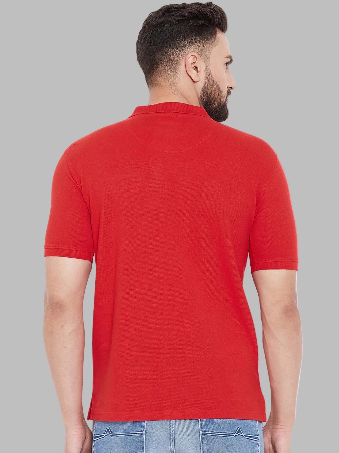 Man wearing a red polo shirt on a white background