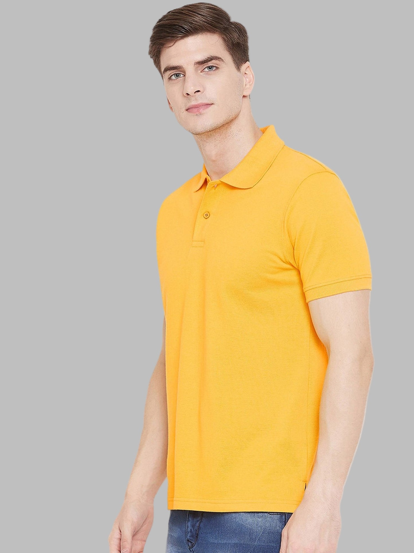 Man wearing a yellow polo shirt on a white background
