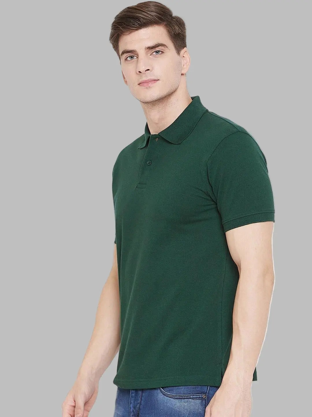 Man wearing a green polo shirt against a white background