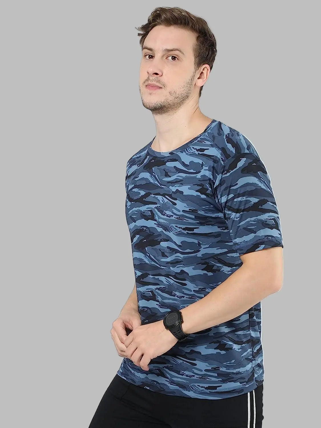 Man wearing a blue camouflage t-shirt on a white background
