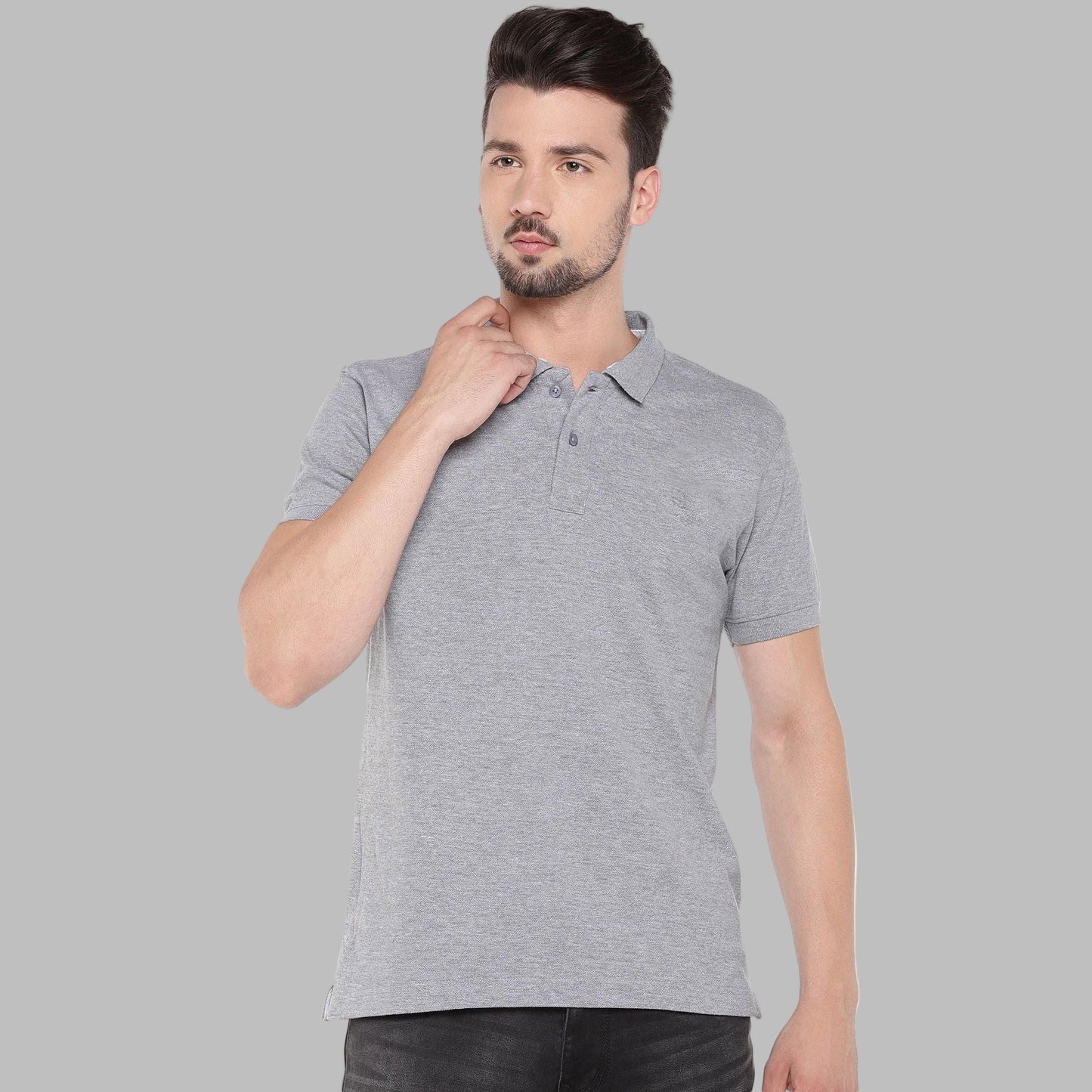 Man wearing a gray polo shirt on a white background