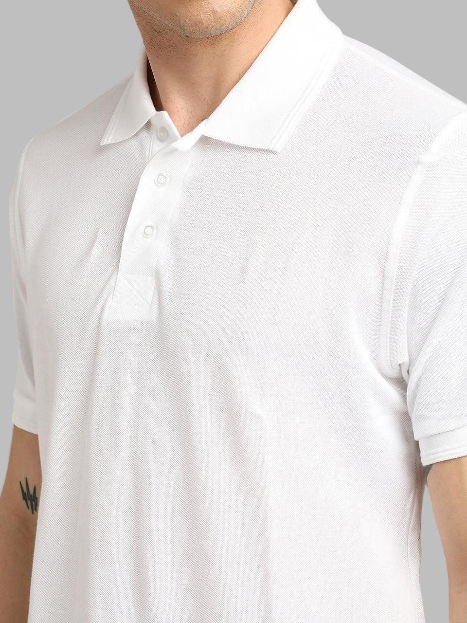 White polo shirt worn by a person on a gray background