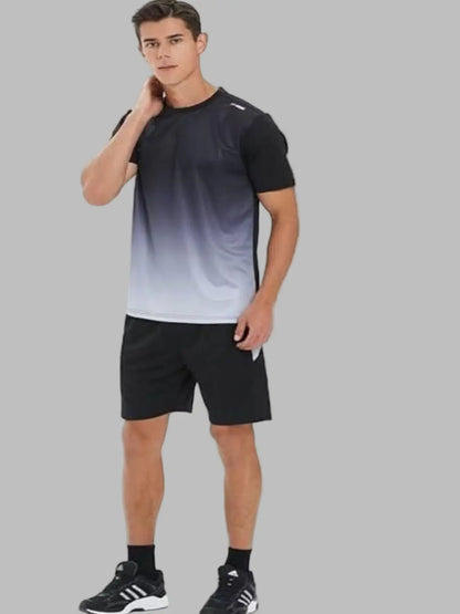 Man wearing a black and gray gradient t-shirt with black shorts on a white background